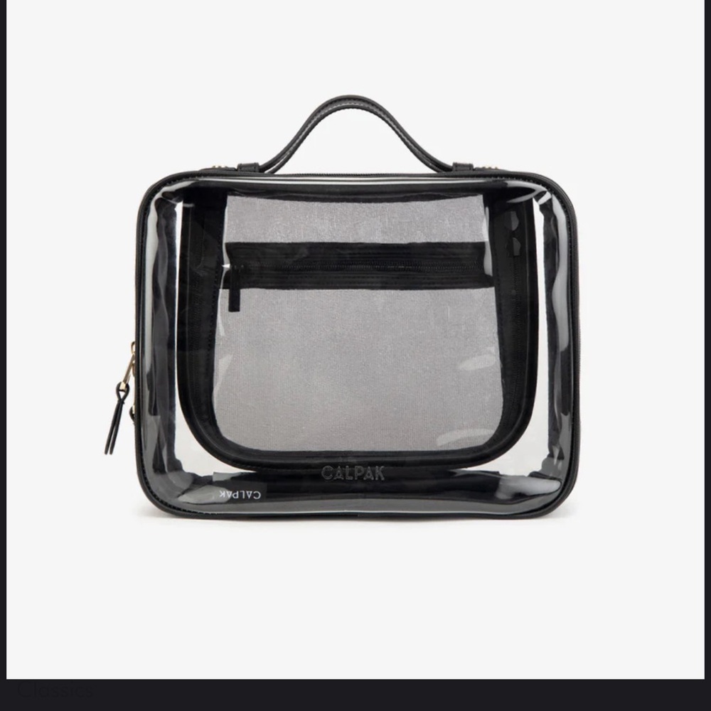 New - Calpak large clear cosmetics case. Black